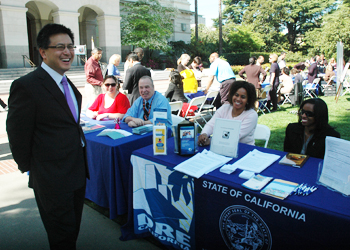 Controller John Chiang visits with Jamie Pope and Matt Manley, both of CalPERS, and Department of Real Estate employees Dionne Faulk and Brenda Smith at the free annual Financial Literacy Fair at the Capitol on April 18, 2012.