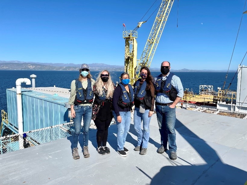 Controller Yee and others stand on Oil Rig